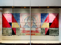 a glass case with a piece of art in it