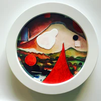 a clock with a painting on it