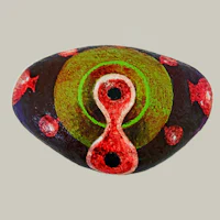 a rock with a red, green, and blue design